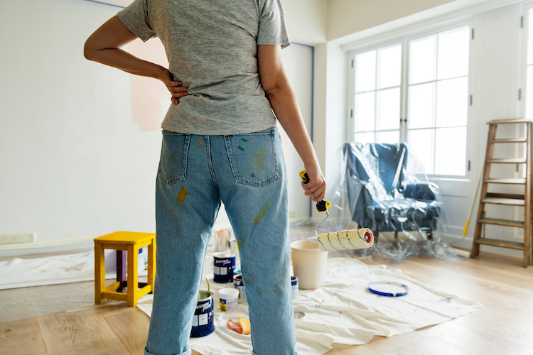 Person Renovating Interior of Home with Paint Roller - K-Guard Heartland