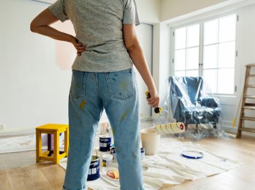 Person Renovating Interior of Home with Paint Roller - K-Guard Heartland