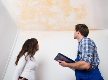Homeowner and Technician Discussing a Ceiling Water Stain - K-Guard Heartland
